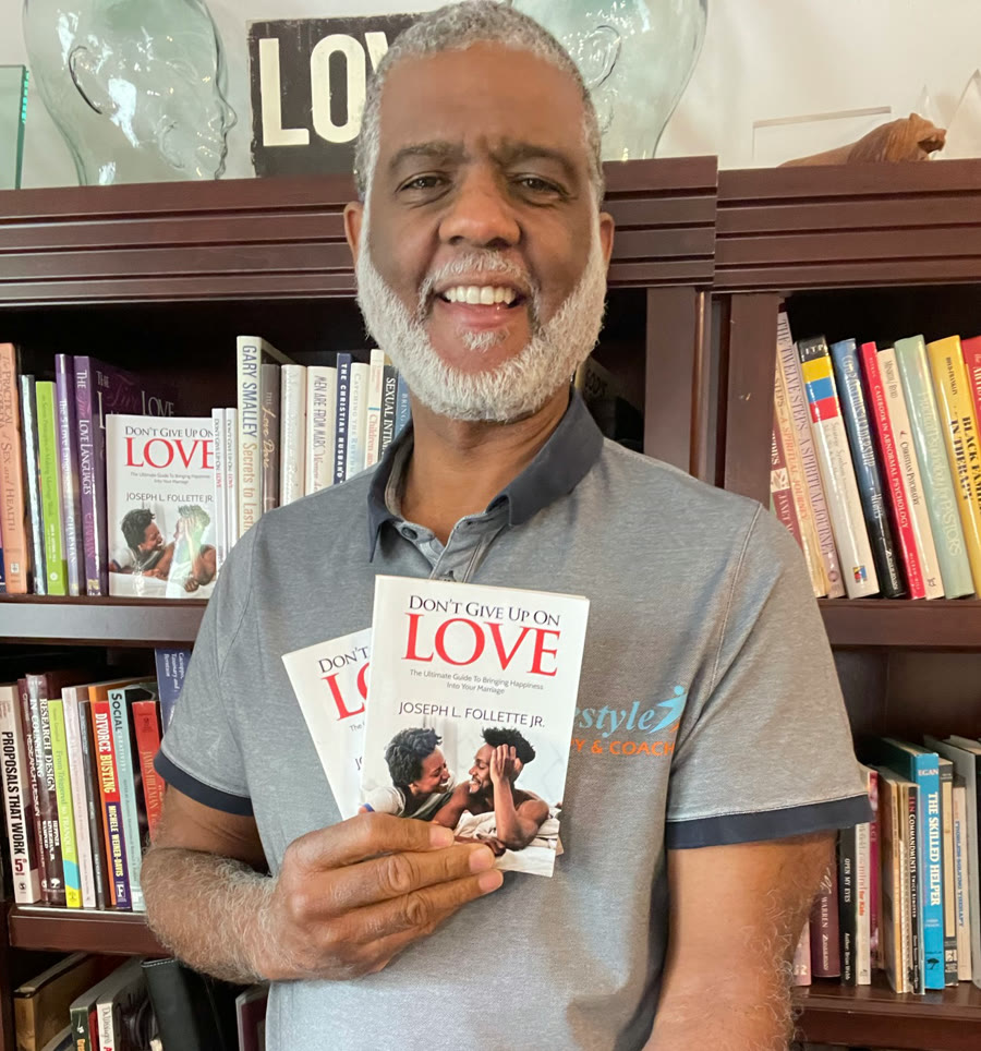 Joe Follette, Jr., LMFT, holding Don't Give Up On Love